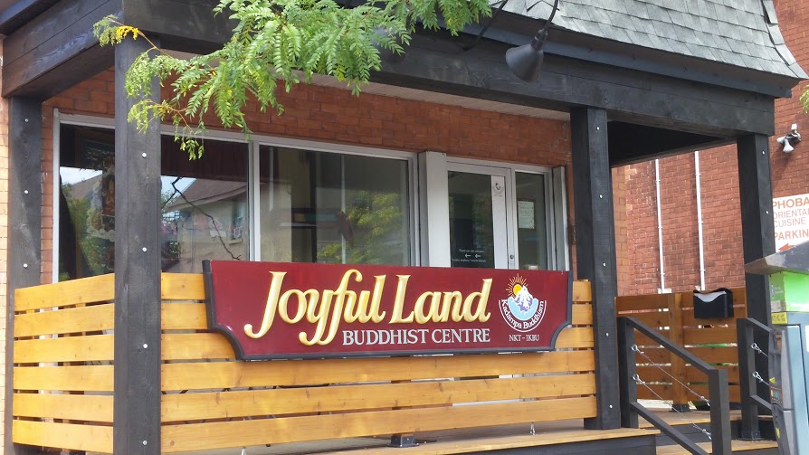 Exterior view of the building, including the Joyful Land building sign and newly renovated porch.